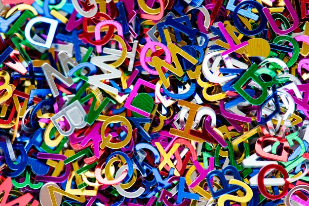 Closeup of colorful alphabets decorative papers closeup