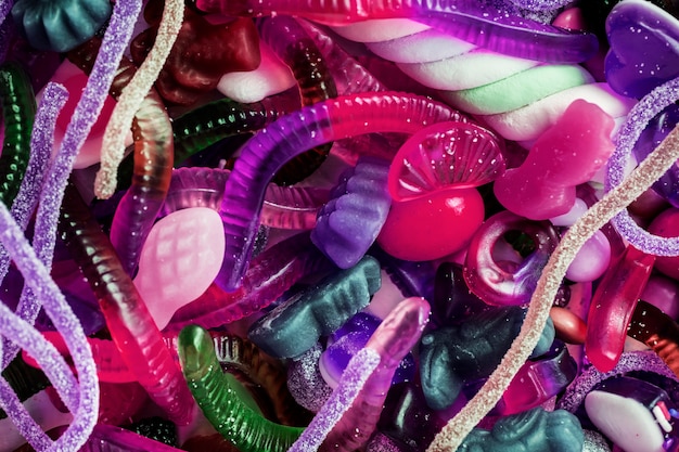 Closeup of colorful assorted jelly worms and other candies