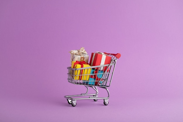 Closeup of colorful gift boxes in a trolley