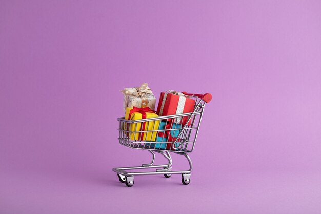 Closeup of colorful gift boxes in a trolley