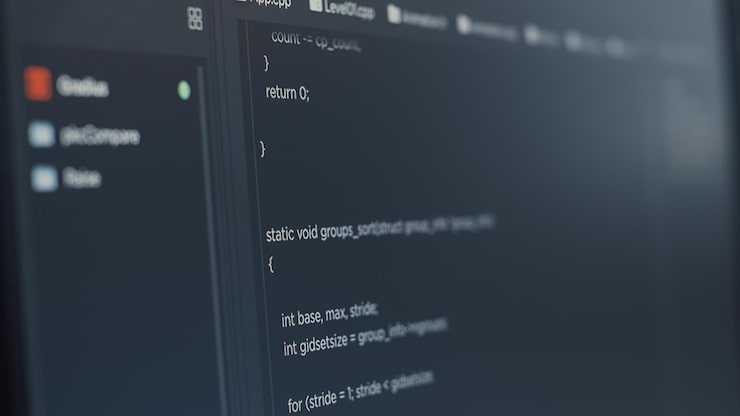 Free Photo closeup of computer screen of software developer typing programming language in it startup agency. display concept of system engineer writing source code. scrolling text of database functions script.