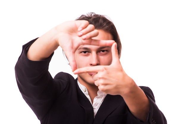 Closeup of confident happy man framing photograph white wall