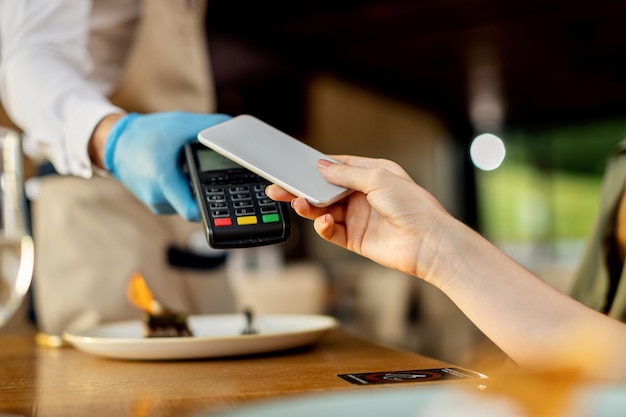 Closeup of contactless payment in a cafe