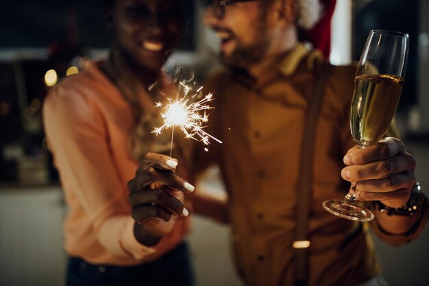 Closeup of a couple having fun on New year's eve at home