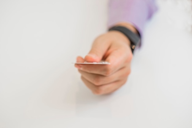 closeup of credit card holded by hand. focus on card