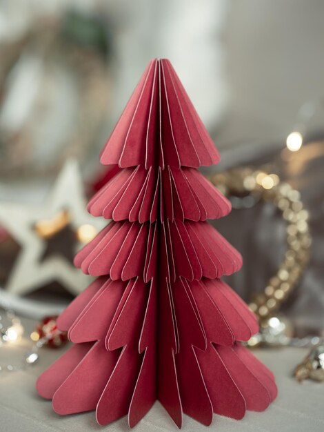 Free photo closeup of a decorative cardboard christmas tree on a blurred background