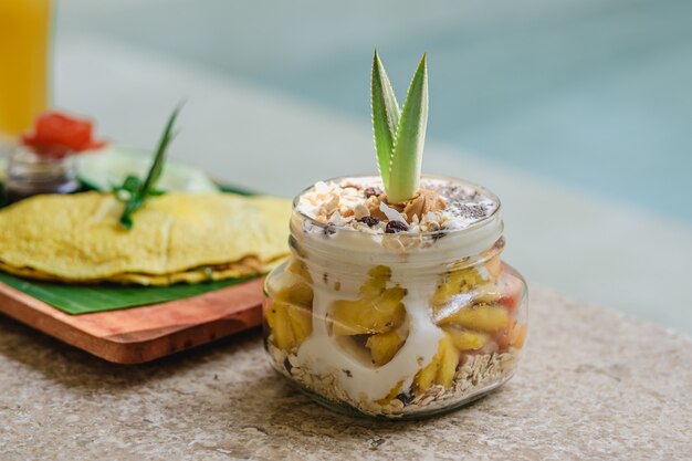 A closeup of a delicious creamy dessert on stone surface