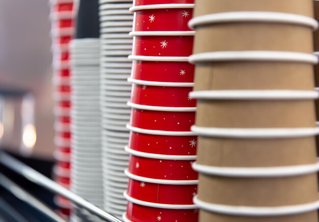 Closeup disposable coffee cups on a coffee machine