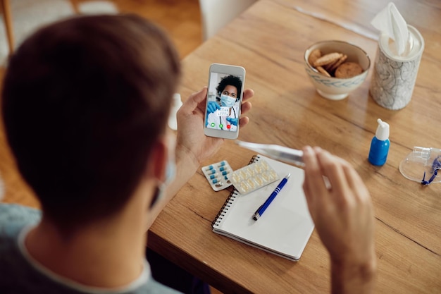 Closeup of doctor advising her patient about medicines via video call during coronavirus pandemic