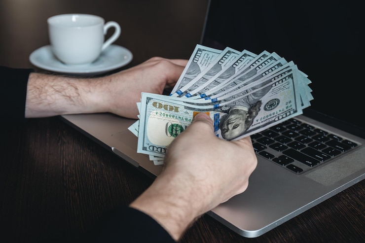 Free Photo closeup dollar bills in male hands the concept of making money and working