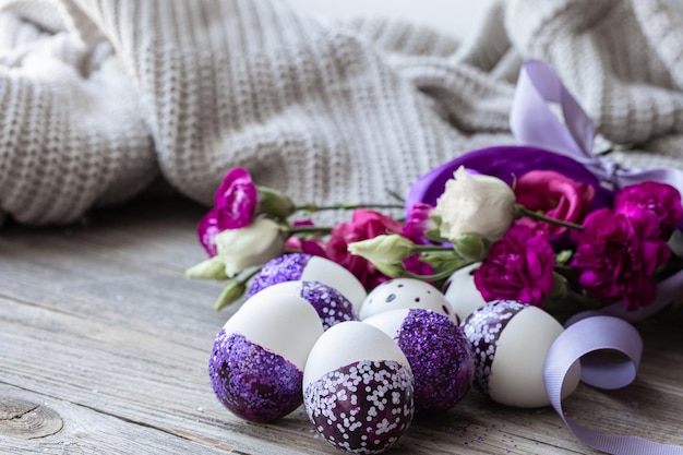 Closeup of easter eggs decorated with purple sparkles