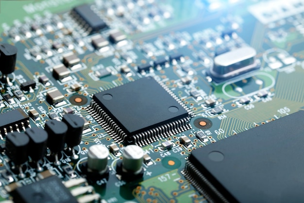 Closeup of electronic circuit board with CPU microchip electronic components background