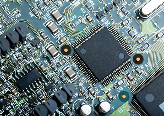 Closeup of electronic circuit board with CPU microchip electronic components background