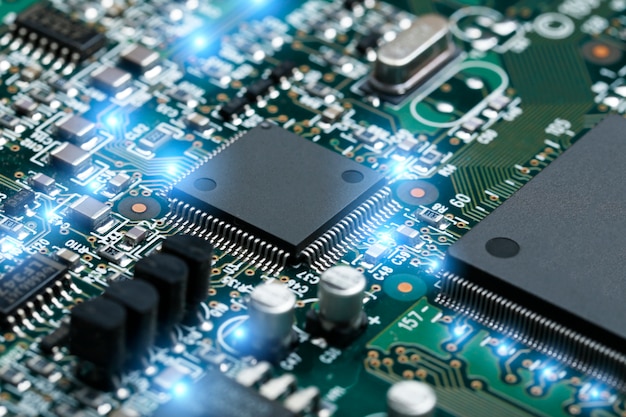 Closeup of electronic circuit board with CPU microchip electronic components background