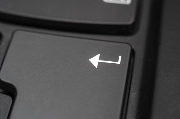 Closeup of a Enter key. Confirmation of data on a computer keyboard