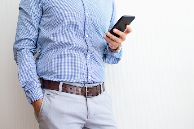 Closeup of entrepreneur texting on smartphone