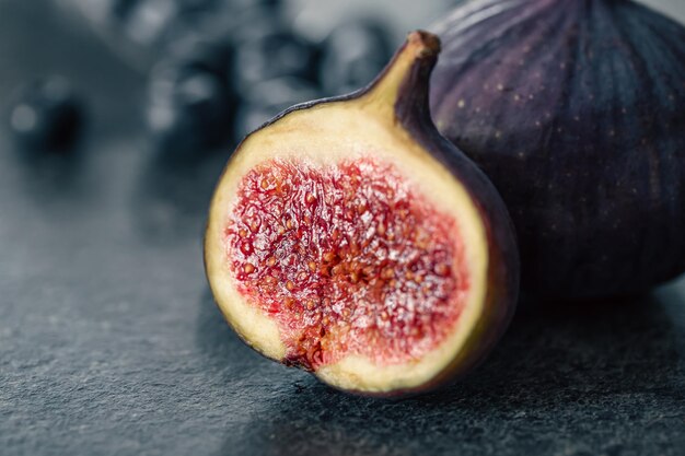 Closeup fig fruit on a blurred dark background