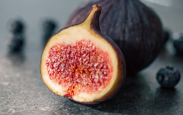 Closeup fig fruit on a blurred dark background