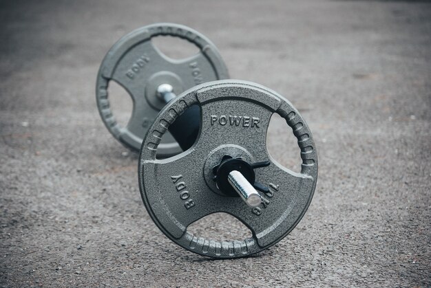 Closeup focus shot of a barbell - concept of exercise/weightlifting