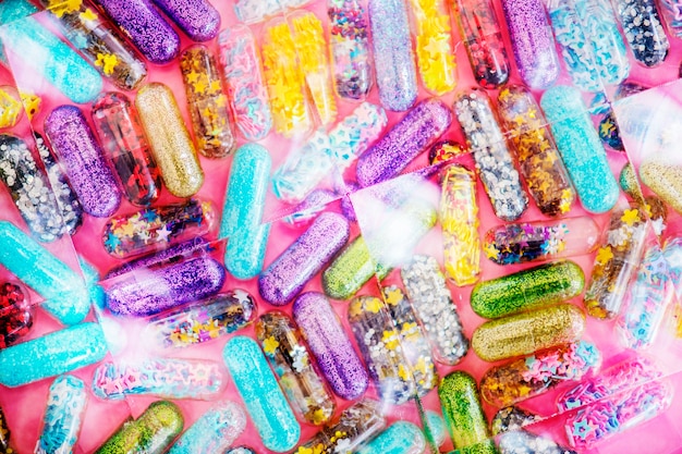 Closeup of glittery shimmery shiny pills capsule background