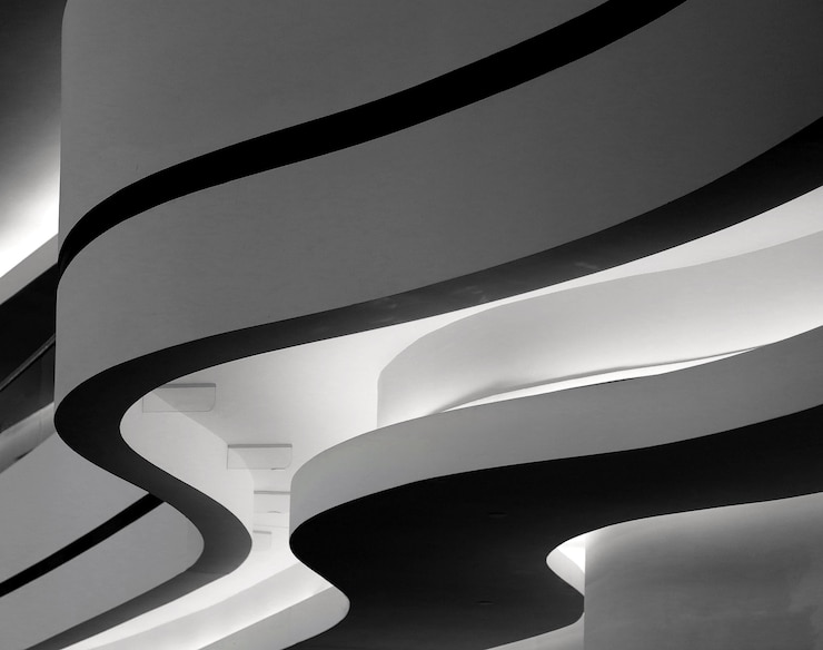 Free Photo closeup greyscale shot of a building with curvy twists in berlin, germany