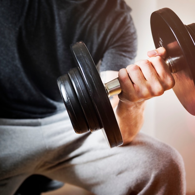 Closeup of hand holding barbell weight training