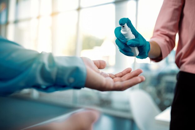 Closeup of hands disinfection during coronavirus pandemic