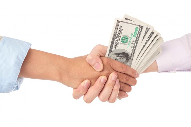 Макрофотография рукопожатие с долларовых купюр в середине