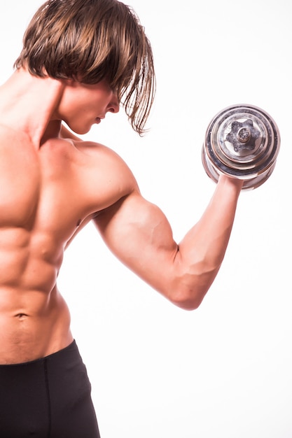 Closeup of a handsome power athletic man bodybuilder doing exercises with dumbbells