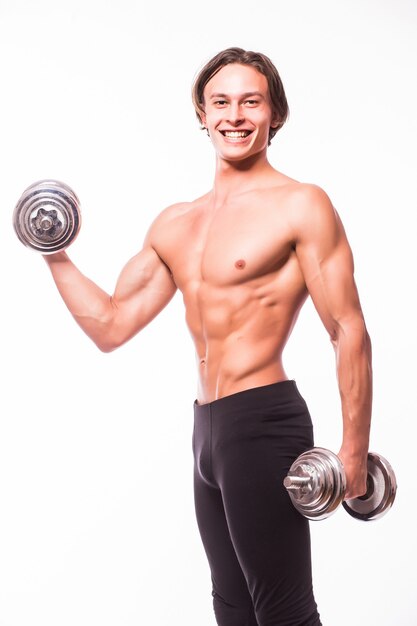 Closeup of a handsome power athletic man bodybuilder doing exercises with dumbbells