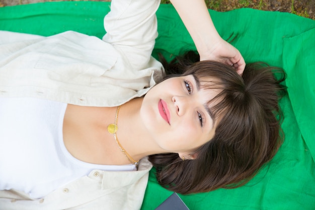 Free photo closeup of happy serene girl relaxing outdoors