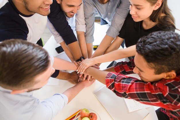 Closeup image of happy people smiling and having round table in board room Real business people showing teamwork in office