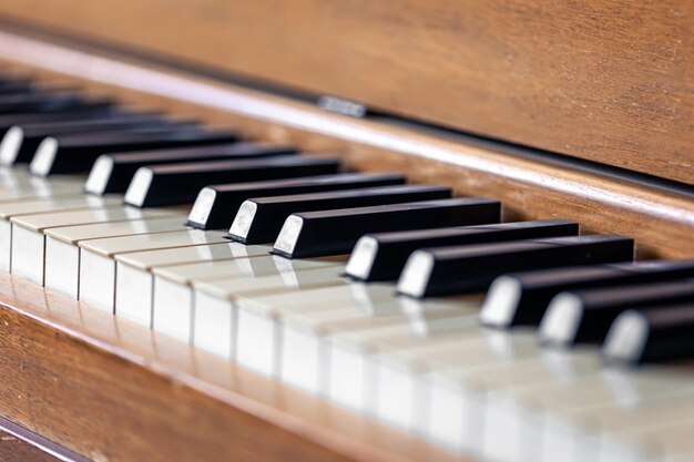 Closeup keys of an antique wooden piano