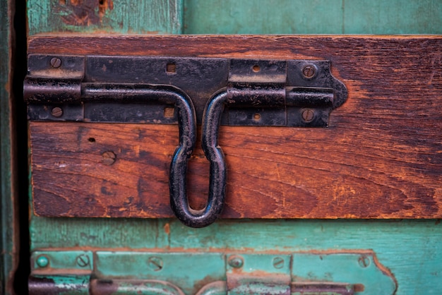 Closeup of latch door look on wooden door