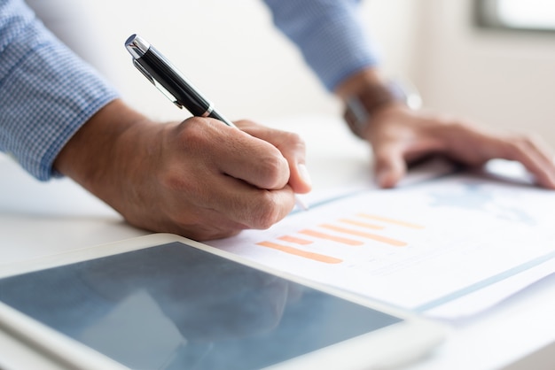 Closeup of man analyzing business data