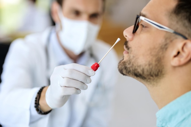 Closeup of a man having PCR test at medical clinic