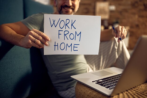 Closeup of man working at home at night