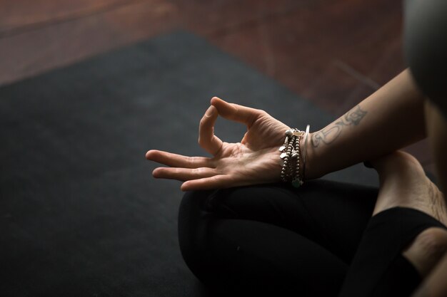 Closeup of mudra gesture, performed with young female fingers