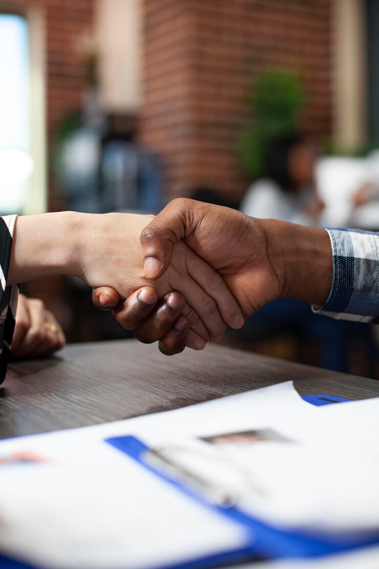 Free Photo closeup of people handshaking in office
