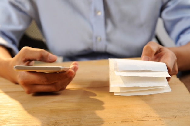 Free photo closeup of person calculating or paying bills