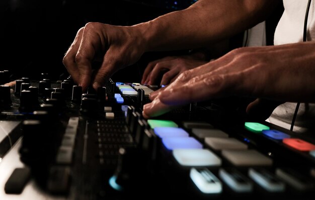 Closeup of a person playing songs and DJing good for partyrelated photos