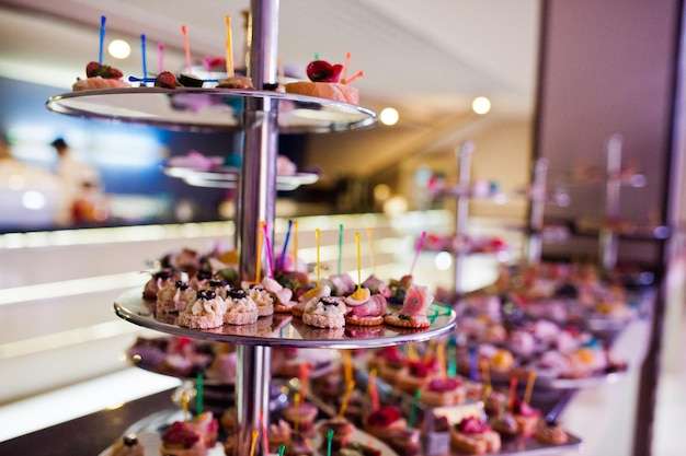 Closeup photo of many canapes on the festive banquet