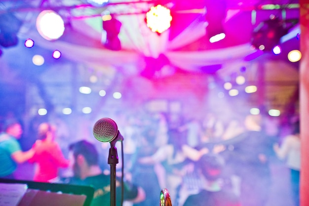 Closeup photo of a microphone in the night club