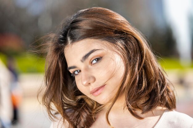 Closeup photo of young lady looking at the camera High quality photo