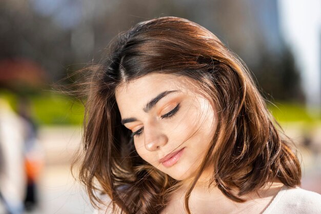 Closeup photo of young lady looking down Hedshot High quality photo