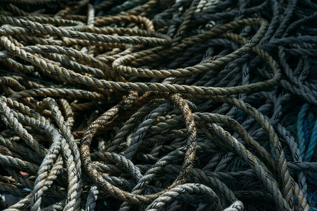 Closeup of a pile of old fishing ropes under the sunlight