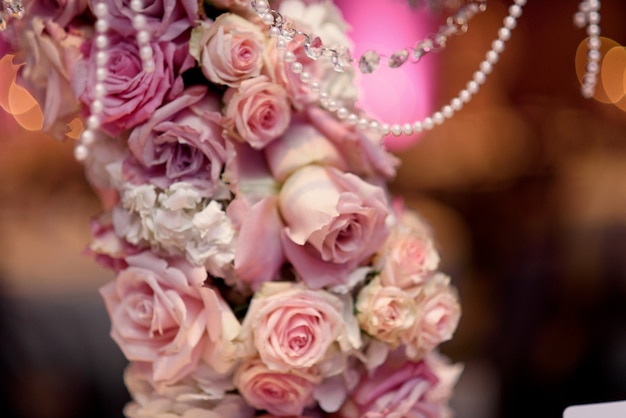 Closeup of pink roses put over the candleholder