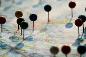 Free photo closeup of pins on the map planning travel journey