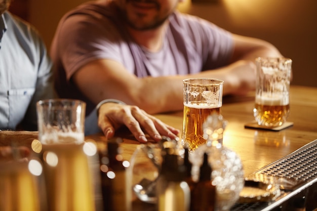 Closeup of pints of beer in bar