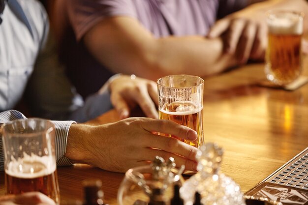 Closeup of pints of beer in bar